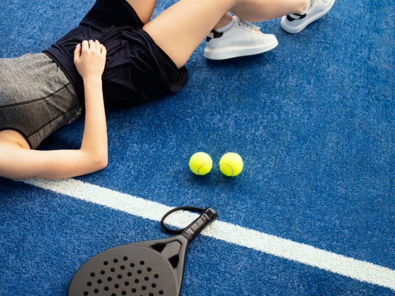 high-angle-tired-woman-laying-ground